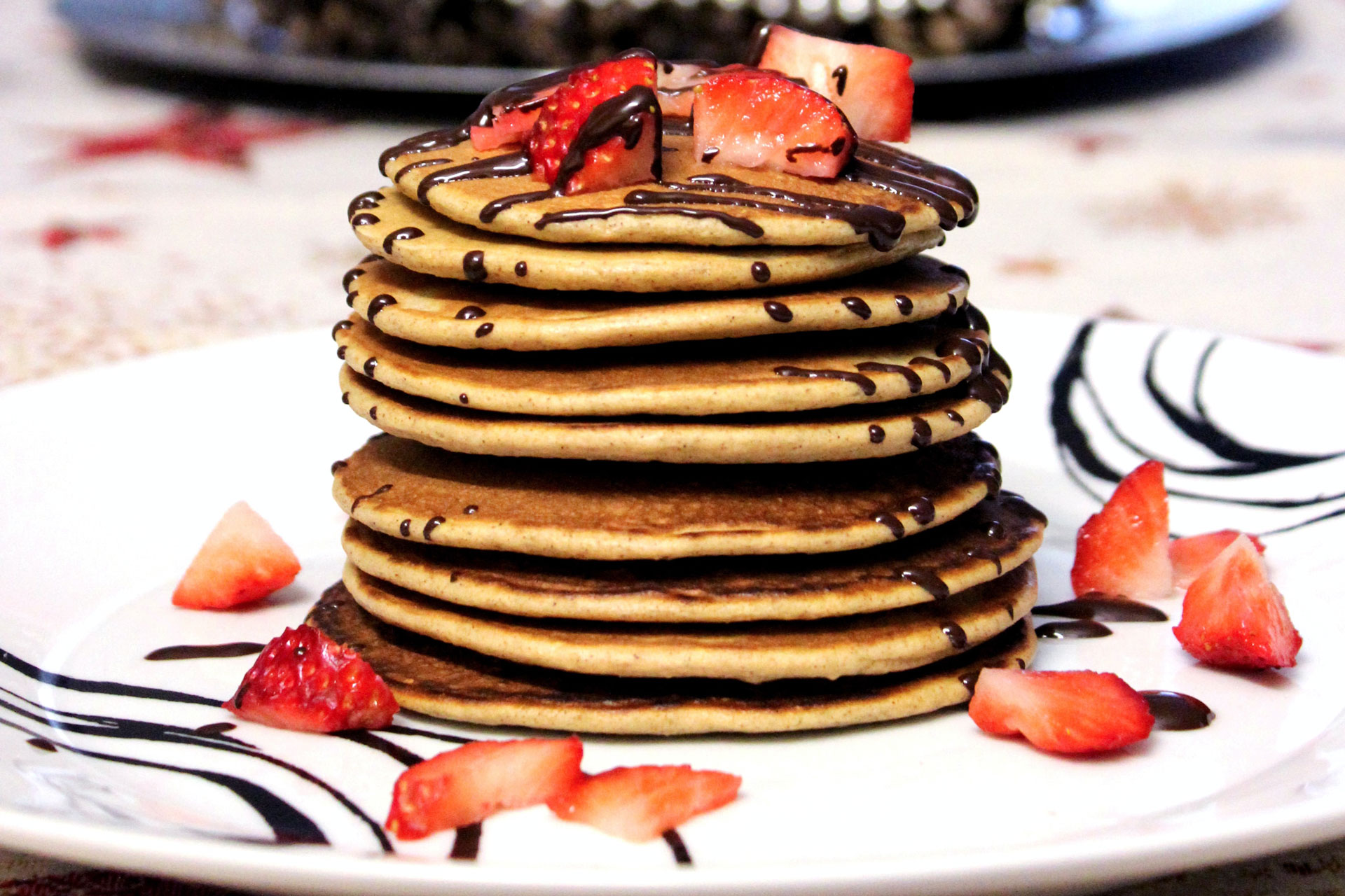 Pancakes with chocolate and strawberries topping