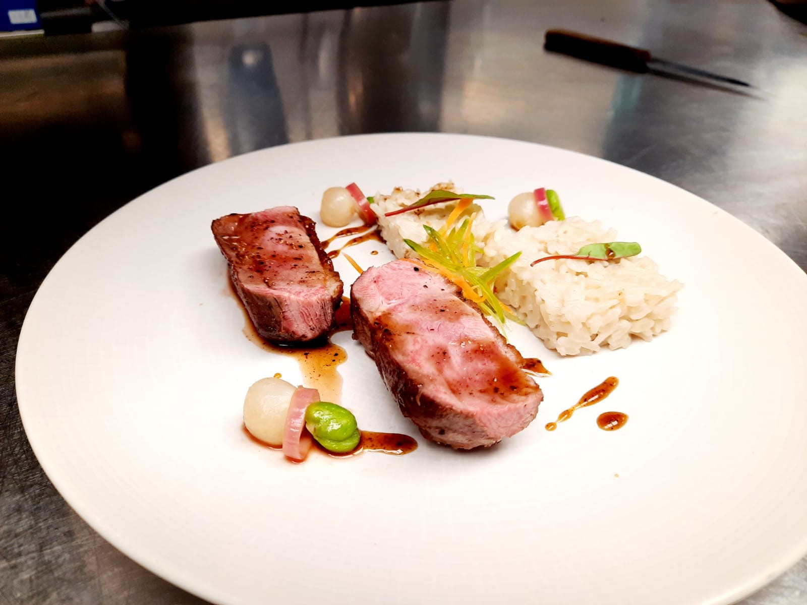 Honey and Szechuan Pepper Glaze Duck Breast With Sticky Coconut Rice, Broad Beans, and Stem Ginger