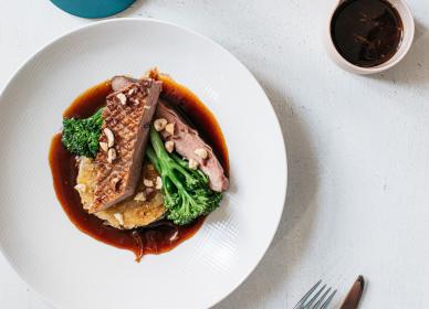 Honey-glazed duck breast, red onion & hazelnut rosti, tenderstem broccoli & Cumberland sauce