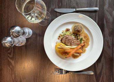 Pork tenderloin with fondant potato, black pudding bonbon and apple gel