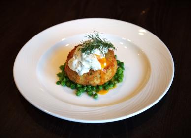 Fish cake with garden pea fricassee poached egg & tartare sauce