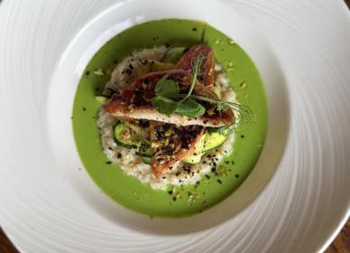 Red mullet with courgette and watercress risotto, topped with pistachio and black olive crumb