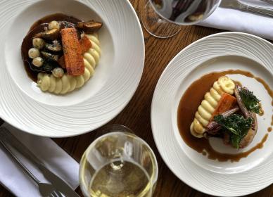 Confit chicken leg, slow cooked with mash potatoes, glazed carrots, kale and a bourguignon jus