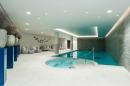 An indoor swimming pool in a home.