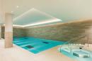 An indoor swimming pool in a home.