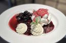 Pavlova with Chantilly cream and black cherry compote
