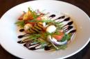 Grilled peach, wild rocket & mozzarella salad, with a balsamic reduction