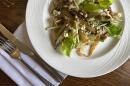 Caramelised endive with blue cheese and apple served with celery, walnuts and finished with a sultana and apple dressing