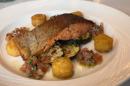 Pan seared sea trout fillet served with grilled courgette, tomato salsa and rosti potato