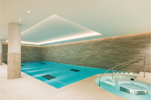An indoor swimming pool in a home.