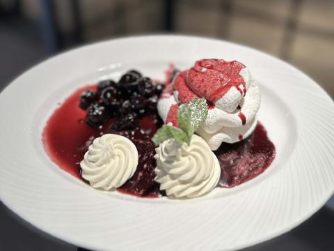 Pavlova with Chantilly cream and black cherry compote