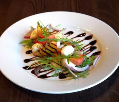 Grilled peach, wild rocket & mozzarella salad, with a balsamic reduction