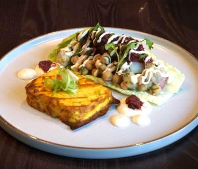 Marinated tandoori tofu served with potato, cucumber & chickpea salad, tangy mint & onion chutney, and yogurt dressing