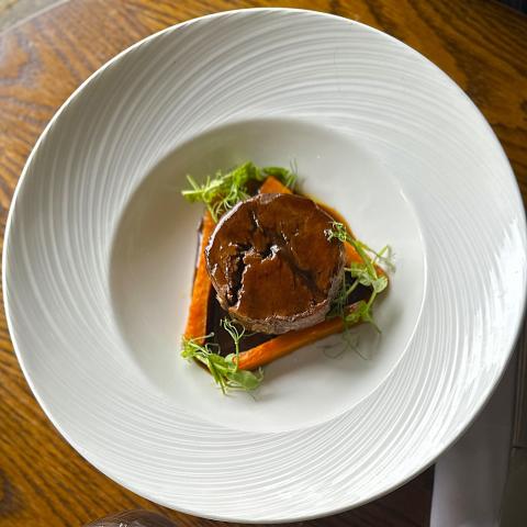 Slow braised beef cooked in Guinness, with colcannon mash, beef dripping carrots, and a rich pan jus