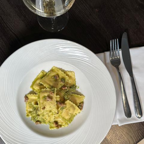 Pumpkin ravioli, buttered spinach, whipped ricotta and walnut pesto
