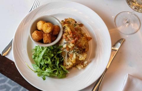 Cauliflower steak served with potato rosti and tomato salsa