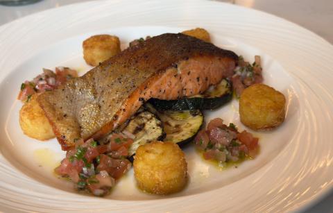 Pan seared sea trout fillet served with grilled courgette, tomato salsa and rosti potato